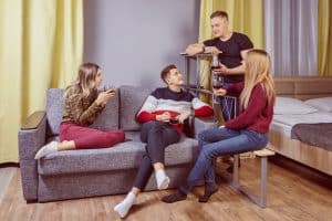 a group of students hanging out inside a room