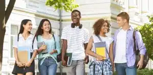 Group of students walking in the school campus.