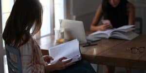 Two students studying on a table.