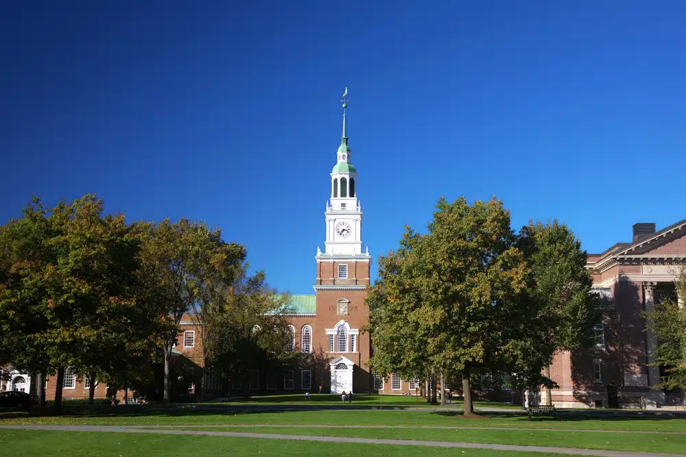 Front building of Dartmouth College surrounded by trees