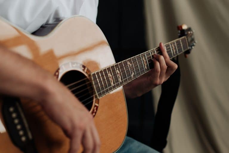 a man playing the guitar