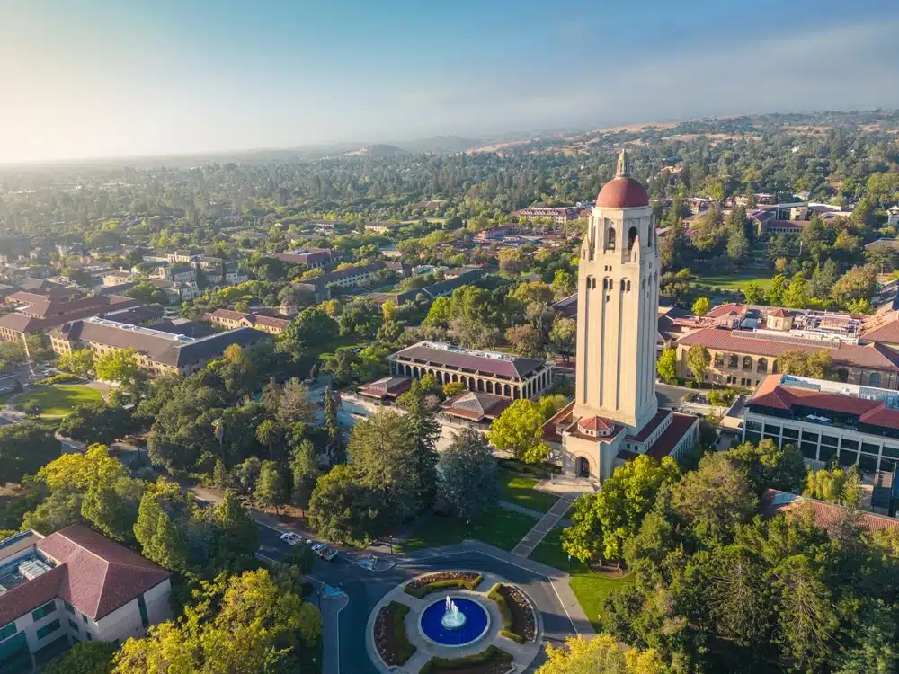 Aerial view of Stanford campus with trees and buildings in sight