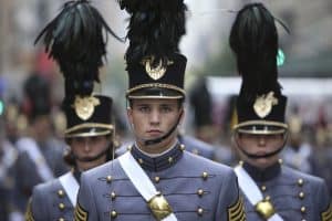 View of students wearing their naval uniform during a parade.