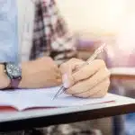 View of an unidentified person answering an exam.