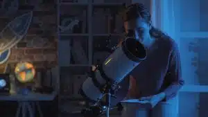 man using a high-end telescope