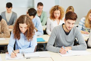 View of students talking an exam.