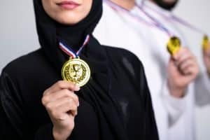 a female student holding on to her medal