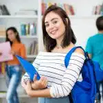 woman figuring out Boston College GPA requirements