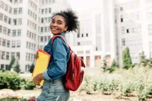 a female student looking at the camera smiling