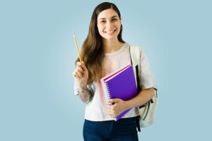 Female student smiling at the camera.