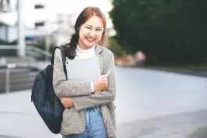 a female student looking at the camera smiling