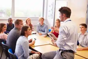 a college class where the professor is demonstrating and everyone is listening