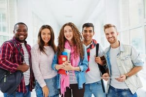 a group of college students looking at the camera