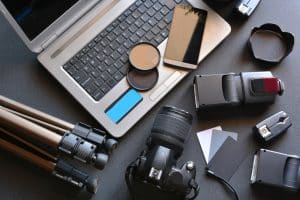 Photography materials placed next to a laptop.