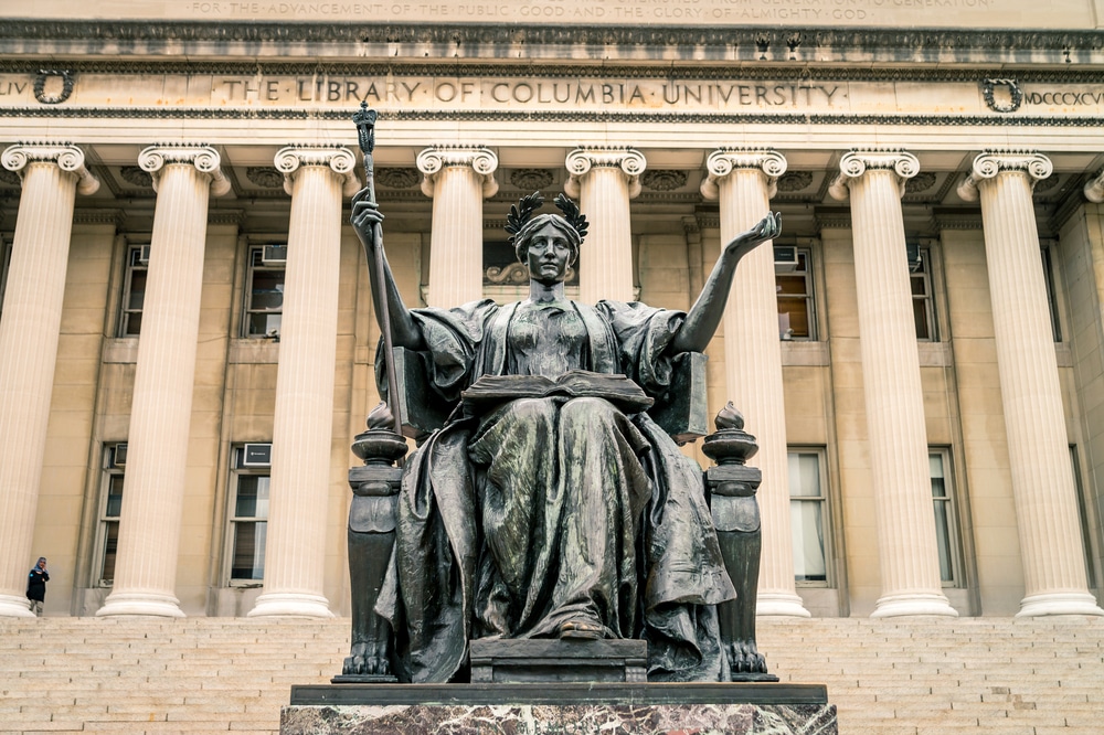 The Columbia University Alma Mater statue and the university library at its back.