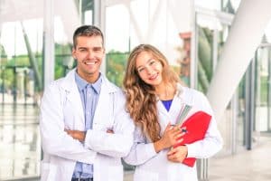 two medical school students facing in the camera