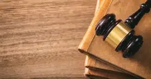 a gavel laying on top of the book