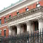 Barnard College's front building with the Barnard application deadline