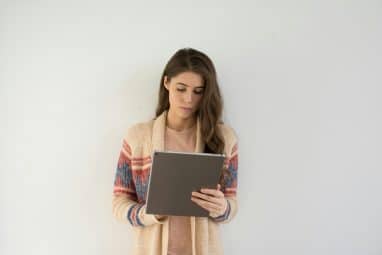 A student studies on a tablet to prepare for the International Physics Olympiad.
