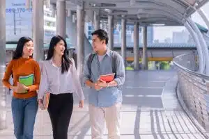 three students in the walkway