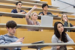 Group of students sitting on their table.