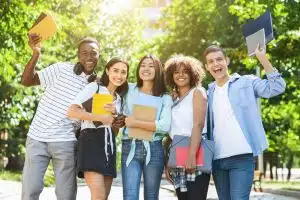 Group of students smiling at the camera.