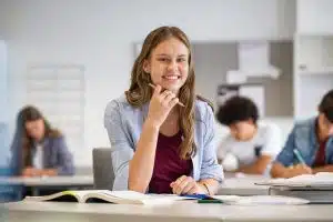 a female high school student looking at the camera