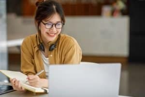 a female intern smiling while looking at the camera