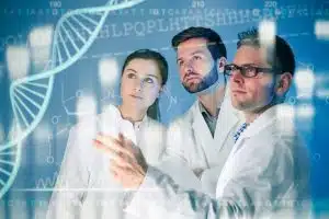 Bioengineers looking at holographic images of a DNA