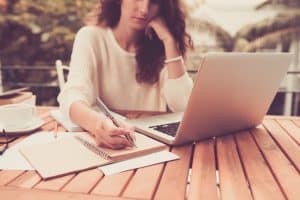 view of a female student writing an essay