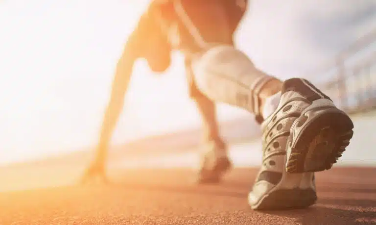 a male runner in a running position