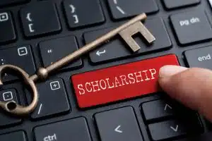 the word scholarship printed on a keyboard key