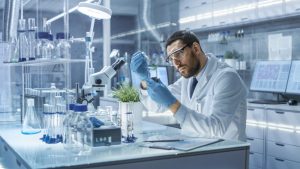 a male adult working inside a laboratory