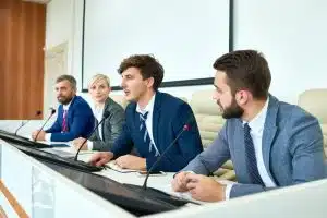 Students debating in a conference room.
