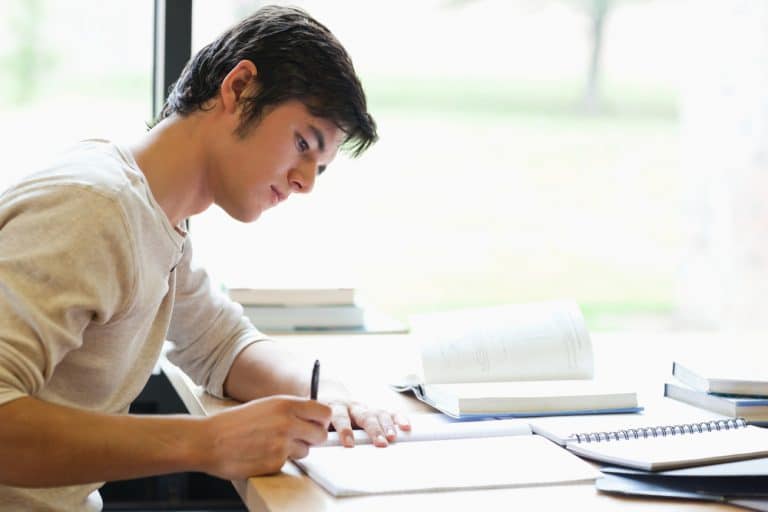 a male student studying intently