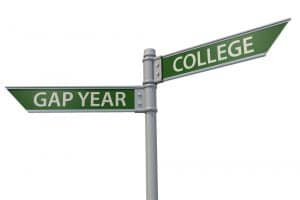 A street sign with a gap year and college.