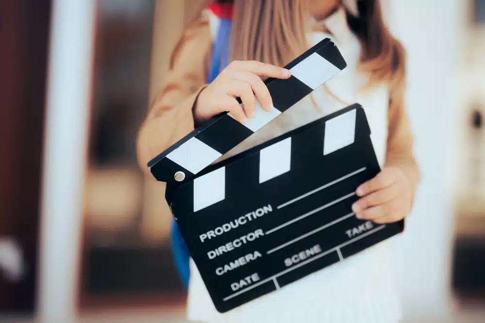 Girl holding a film slate