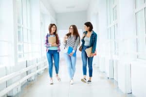 Group of students walking in the hallway.