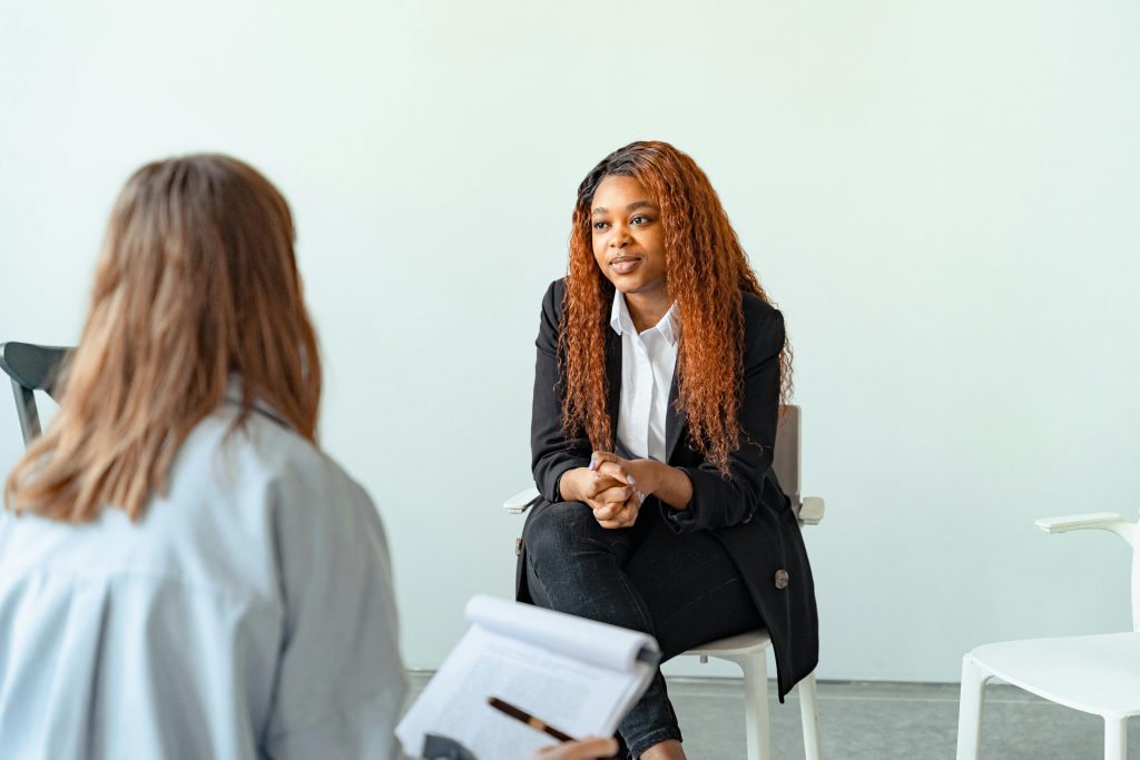 High school student sat across an adult for an interview