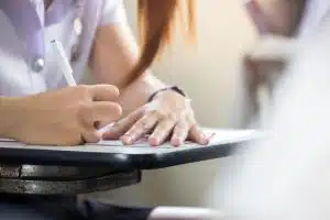 Writing on an arm chair.