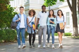 Group of students walking in the campus.