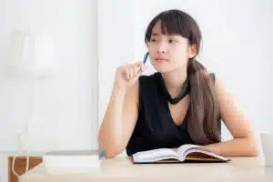 a female student thinking/studying