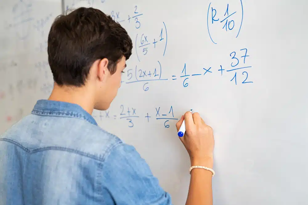a male student solving a math problem