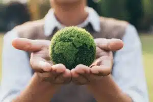 A student holding a model of the earth