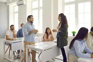 View of a man talking to a teacher.