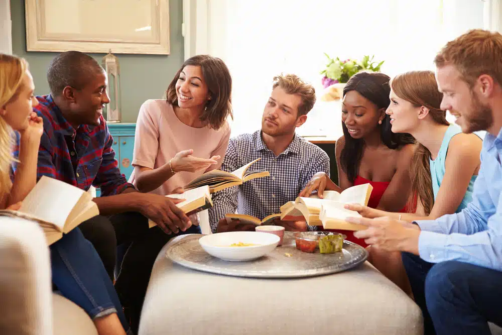 Students talking to each other in a book club.