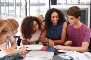 A teacher talking to her middle school students.