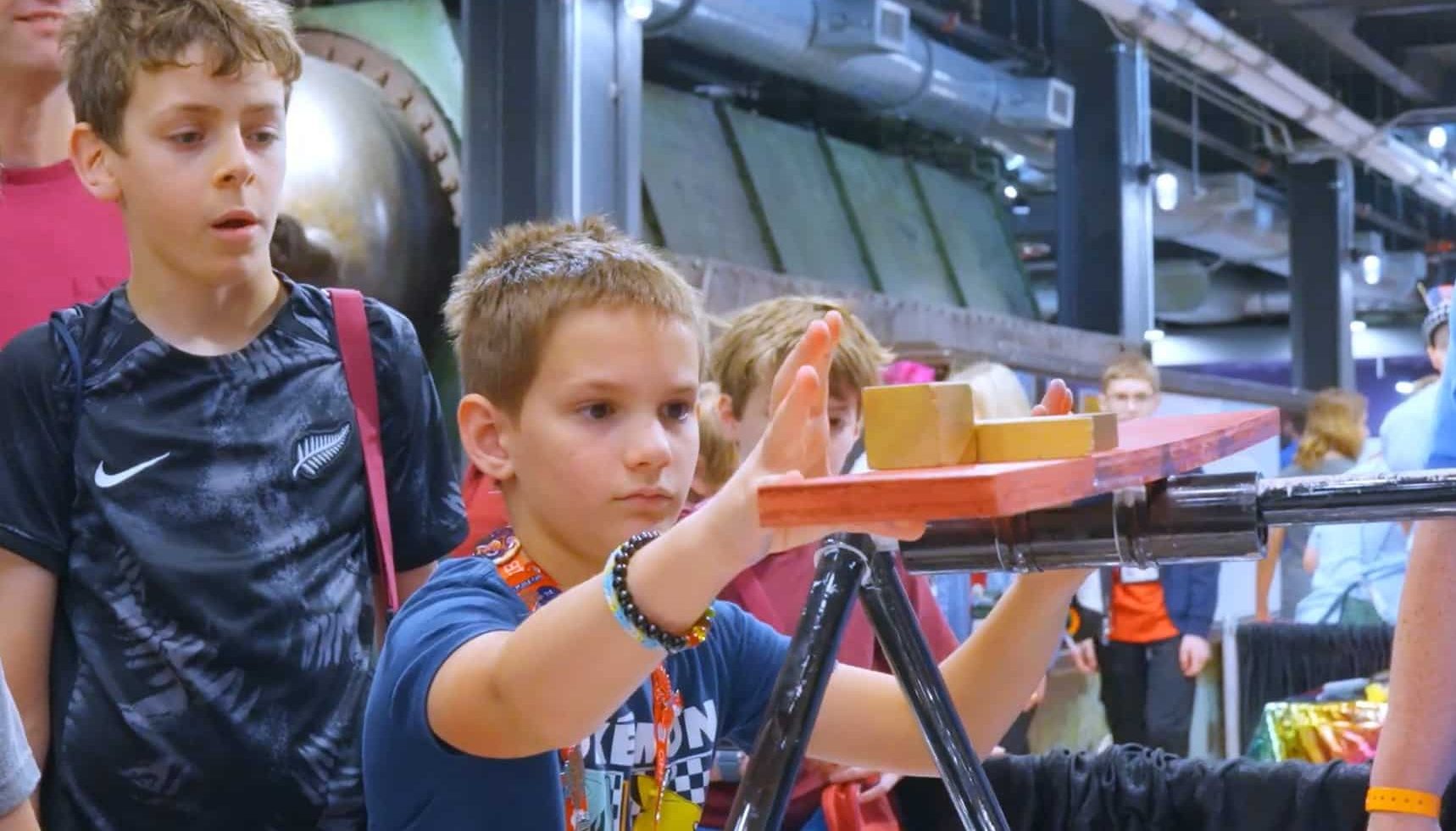 student balancing a wood on a structure for odyssey of the mind
