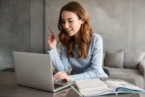 Female student studying in a room.