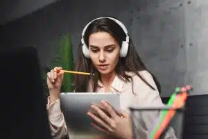 View of a woman using a gadget to study a language.